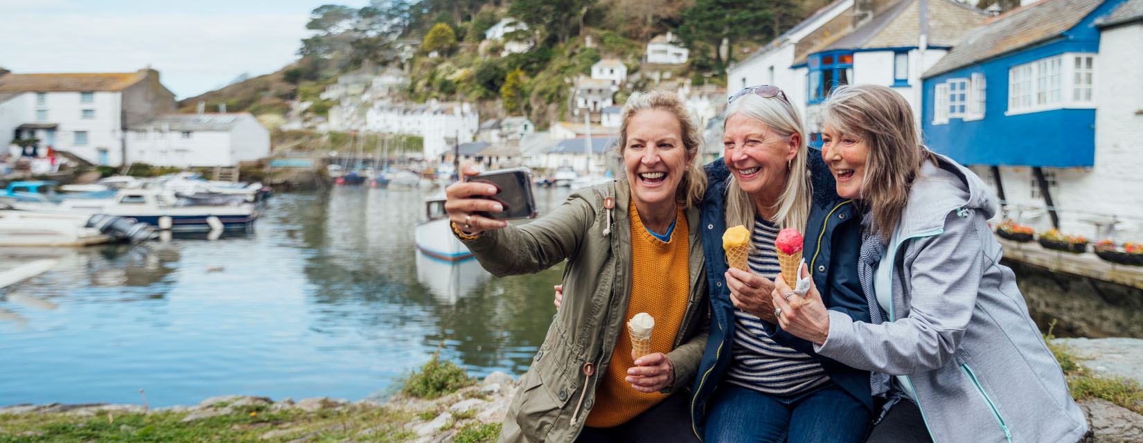 Friends having ice-cream on the quay