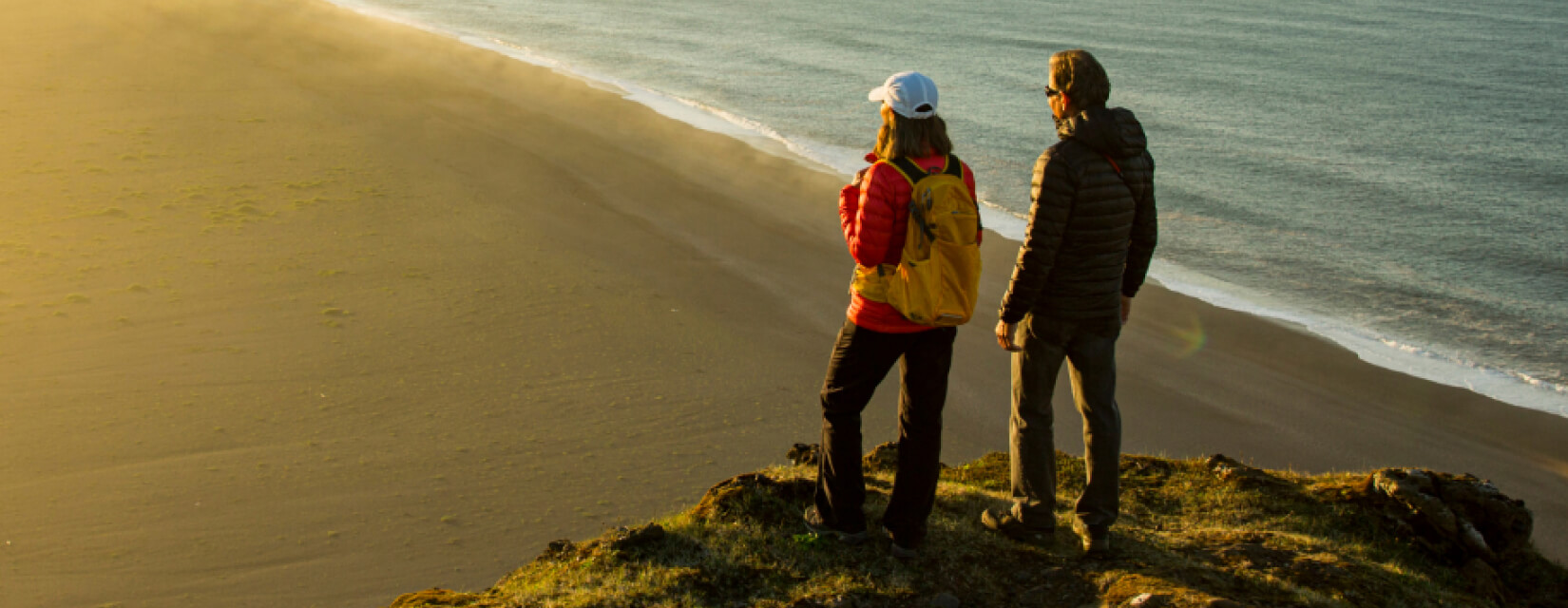 Couple looking out onto the beach