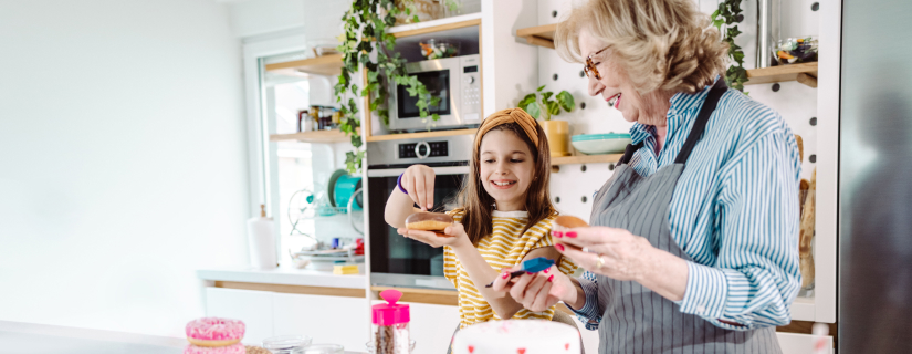Grandmother and daughter making donuts