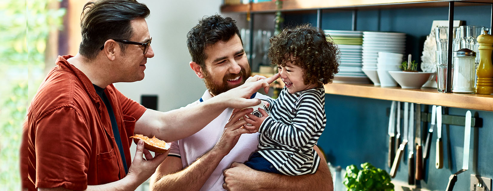 Male couple-child-kitchen