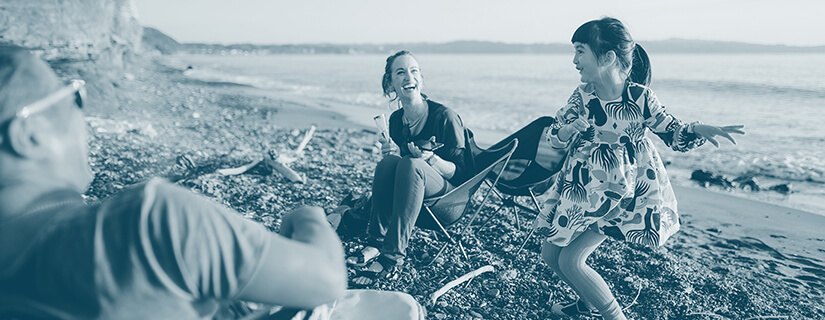 Father, mother and girl dancing in beach