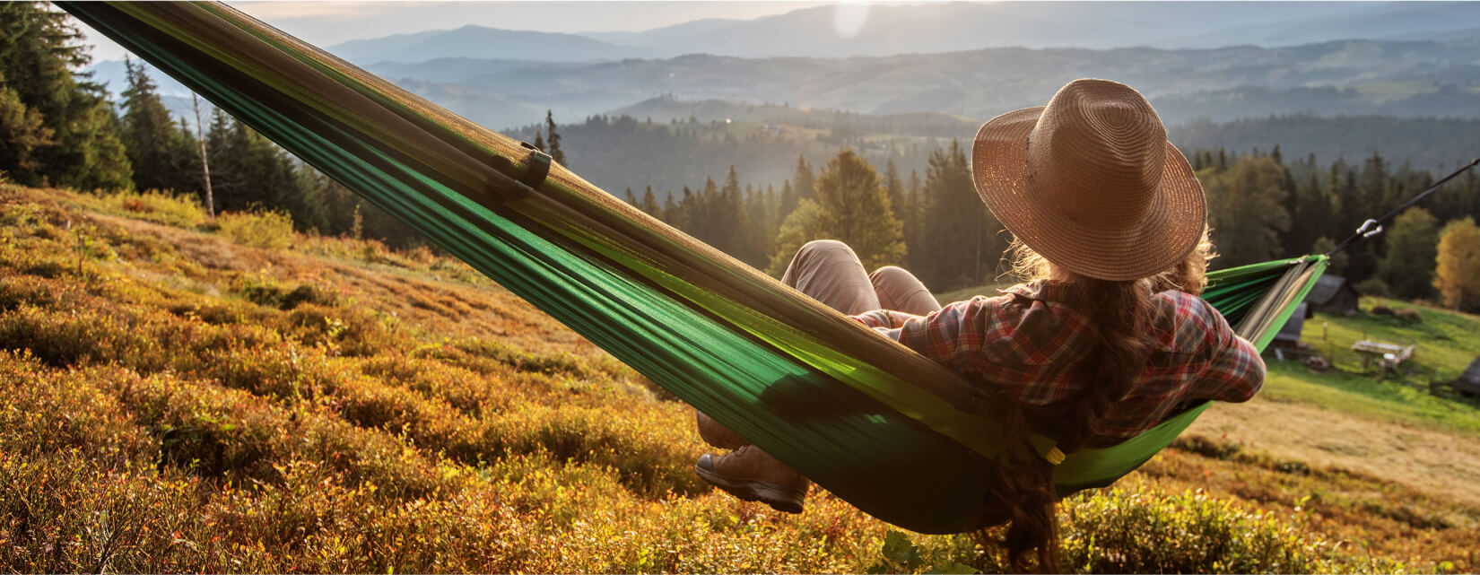 Woman in a field on a hammock