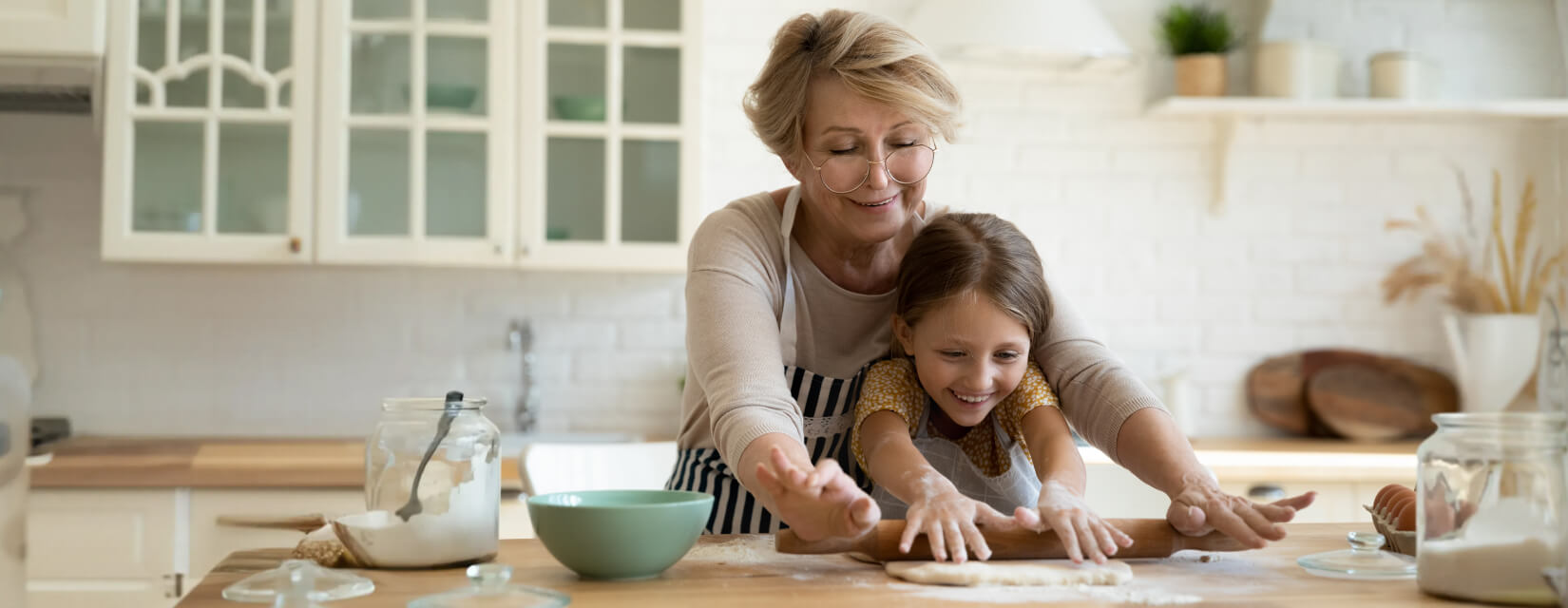 Grandmother and granddaughter  baking in the kitchen