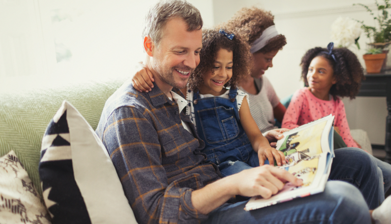 Father and child reading a book