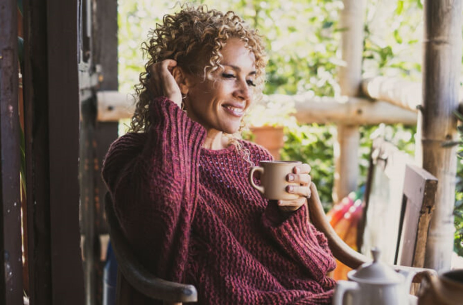 lady-relaxing-cup-porch-768x440