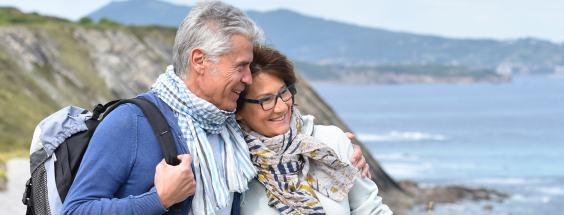 Couple walking along the coast