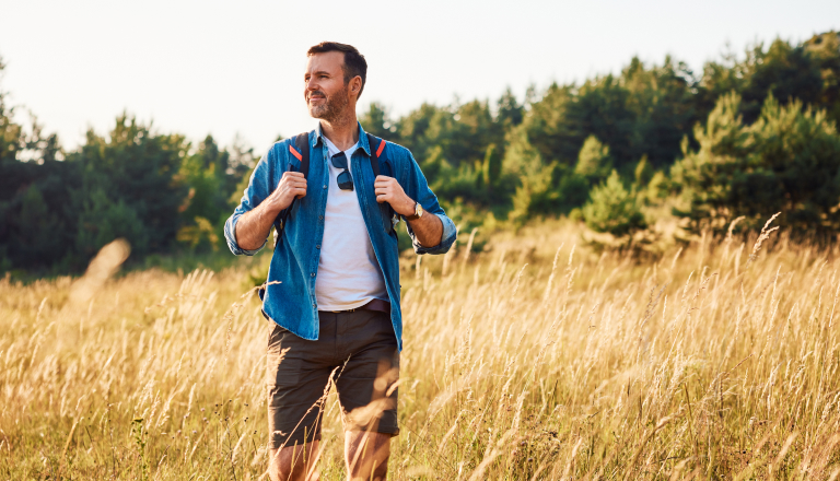 Man walking in corn fields
