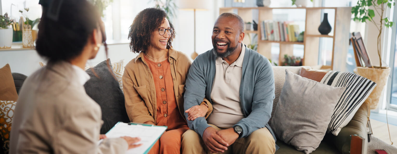 Couple in their 50s speaking with a finance manager