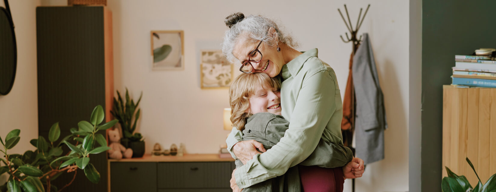 Loving grandmother hugging a young grandson