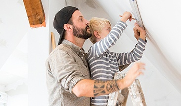 boy helping his dad do DIY