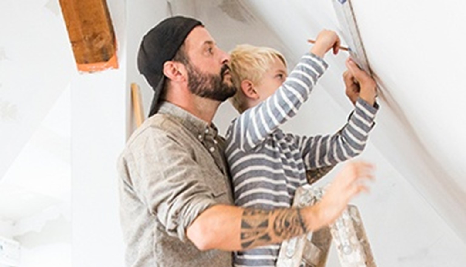 boy helping his dad do DIY