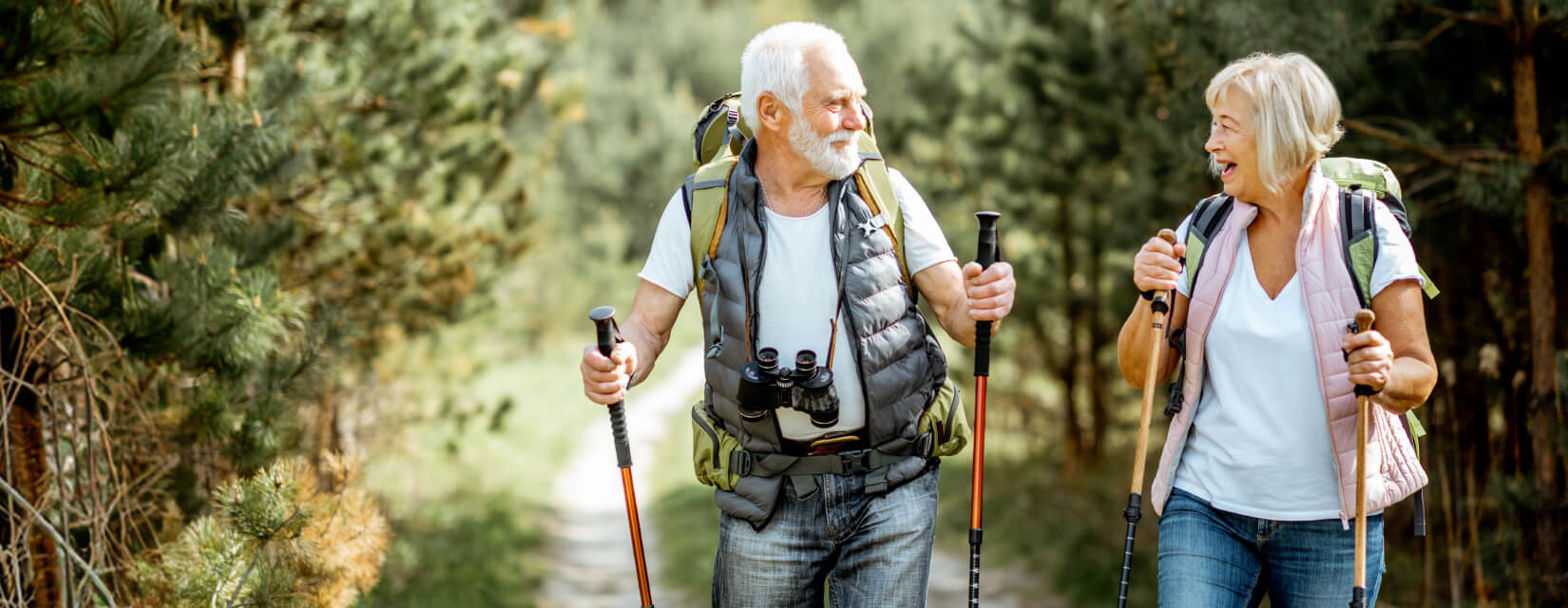 Older couple hiking on a sunny day