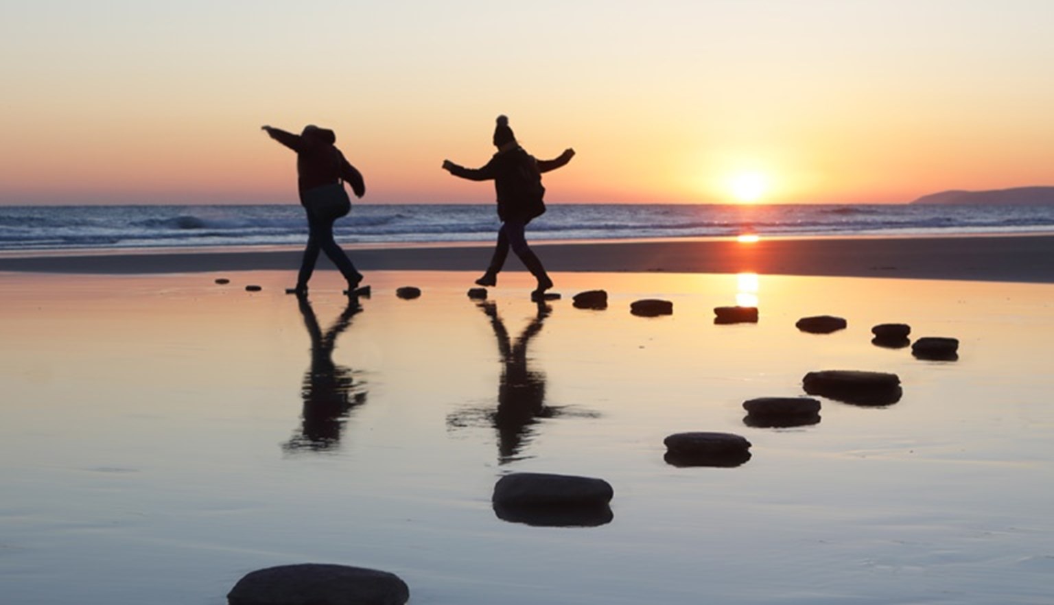 stepping stones on the beach water