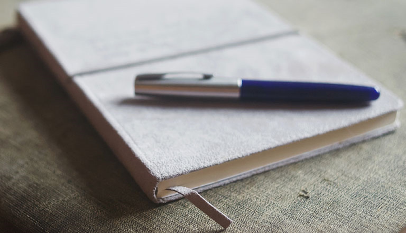 pen with journal notebook