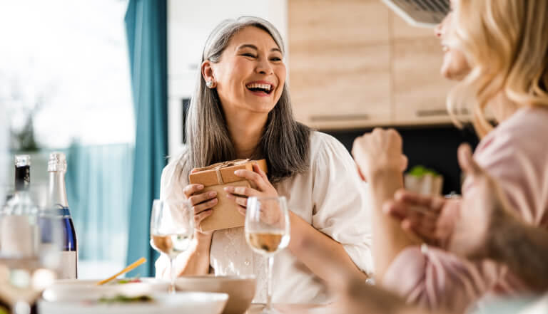 Happy woman receiving a gift