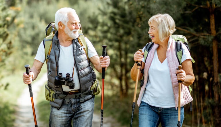 Older couple hiking on a sunny day